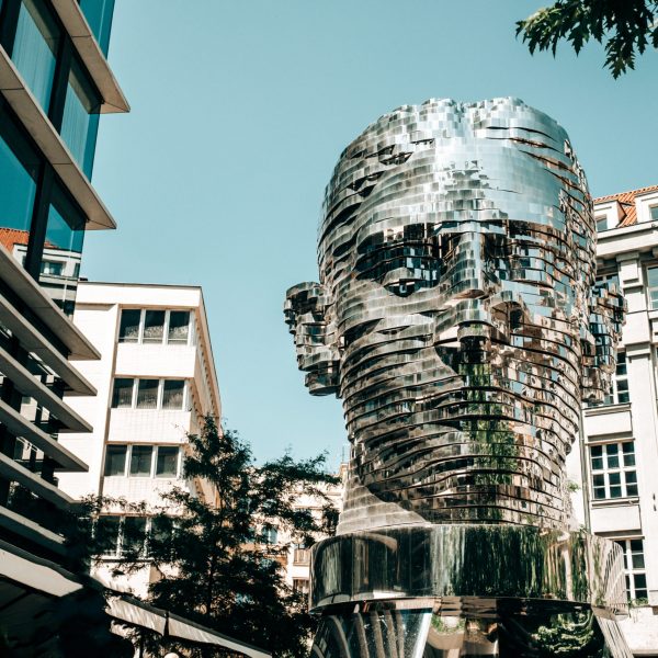 Moving mirror statue of Franz Kafka by David Cerny. Big metalmorphosis head sculpture. High quality photo